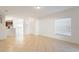 Open-concept living room with tile flooring, white walls, and lots of natural light from a large window at 2851 Sunstone Dr # 2851, Kissimmee, FL 34758