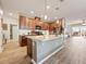 Kitchen island with granite countertops and stainless steel appliances at 2941 Marlberry Ln, Clermont, FL 34714