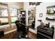 Well-equipped barber shop space featuring dark wood floors, a modern barber chair, and large mirror at 2962 Lucayan Harbour Cir # 102, Kissimmee, FL 34746