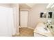 Bright bathroom with double sinks, neutral tile, and a shower with white curtain at 2962 Lucayan Harbour Cir # 102, Kissimmee, FL 34746