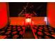 Themed bedroom with two beds with Star Wars bedding and a Darth Vader mural in red light at 2962 Lucayan Harbour Cir # 102, Kissimmee, FL 34746