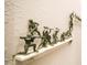 Army men decorations on the wall above a white shelf add playful detail to the interior at 2962 Lucayan Harbour Cir # 102, Kissimmee, FL 34746