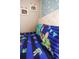 Close up on two beds featuring Toy Story themed bedding and cloud wallpaper at 2962 Lucayan Harbour Cir # 102, Kissimmee, FL 34746