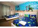 Fun bedroom featuring two beds with Toy Story themed decor and an eye-catching character mural at 2962 Lucayan Harbour Cir # 102, Kissimmee, FL 34746