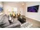 Cozy living room with a comfortable sofa, stylish rug, and a wall-mounted television at 2962 Lucayan Harbour Cir # 102, Kissimmee, FL 34746