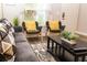 Comfortable living room featuring a plush sofa, stylish rug, and natural light from a large window at 2962 Lucayan Harbour Cir # 102, Kissimmee, FL 34746