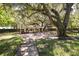 Beautiful park featuring a covered pavilion, picnic tables, and large shade trees at 2962 Lucayan Harbour Cir # 102, Kissimmee, FL 34746