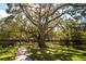 Beautiful park featuring a covered pavilion and large shade trees and well-maintained landscaping at 2962 Lucayan Harbour Cir # 102, Kissimmee, FL 34746