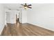 Bedroom featuring new floors, ceiling fan, and multiple doors at 3008 Thornton Dr, Kissimmee, FL 34741