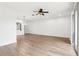 Expansive living room boasting hardwood floors, a ceiling fan, and sliding glass doors to the outdoor space at 3008 Thornton Dr, Kissimmee, FL 34741
