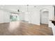Bright living room with hardwood floors, ceiling fan, and sliding glass door to the patio at 3008 Thornton Dr, Kissimmee, FL 34741