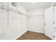 A walk-in closet featuring white walls and wire shelving for ample storage space at 3008 Thornton Dr, Kissimmee, FL 34741