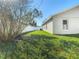 Backyard is fully fenced and features a large lawn and a screened in pool area at 3123 Fairfield Dr, Kissimmee, FL 34743