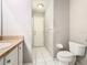 This bathroom features a toilet and vanity with granite countertop at 3123 Fairfield Dr, Kissimmee, FL 34743