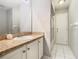 This bathroom features a vanity with granite countertop and a bathtub with shower at 3123 Fairfield Dr, Kissimmee, FL 34743