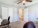 Clean bedroom features include neutral carpet, a view of the ensuite bathroom and good natural light at 3123 Fairfield Dr, Kissimmee, FL 34743