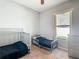 This bedroom features a window, carpet, and two beds at 3123 Fairfield Dr, Kissimmee, FL 34743
