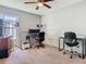 Carpeted bedroom with ample space for multiple workspaces and other activities at 3123 Fairfield Dr, Kissimmee, FL 34743