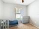 This bedroom features a window, carpet, and two beds at 3123 Fairfield Dr, Kissimmee, FL 34743