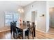 Dining room featuring a hardwood table set, natural lighting, and wood flooring at 3123 Fairfield Dr, Kissimmee, FL 34743