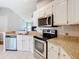 Kitchen with granite countertops and stainless steel appliances at 3123 Fairfield Dr, Kissimmee, FL 34743