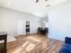 Open-concept living and dining area with wood flooring and neutral color palette at 3123 Fairfield Dr, Kissimmee, FL 34743