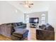 Relaxing living room with hardwood floors and a large television for entertainment at 3123 Fairfield Dr, Kissimmee, FL 34743