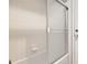 Shower over tub with tile surround and glass doors at 3123 Fairfield Dr, Kissimmee, FL 34743