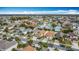 Scenic aerial view of a charming residential neighborhood boasting well-maintained homes and lush green trees at 3233 Brewster Dr, Kissimmee, FL 34743