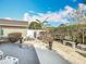 Fenced backyard featuring a patio and mature plants and trees and bench at 3233 Brewster Dr, Kissimmee, FL 34743