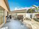 Fenced backyard featuring a patio and mature plants and trees and patio furniture at 3233 Brewster Dr, Kissimmee, FL 34743