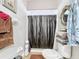 Clean bathroom with white toilet, complemented by a black shower curtain at 3233 Brewster Dr, Kissimmee, FL 34743
