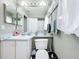 Bathroom with shower/tub combo, decorative wall hangings, and neutral-colored walls at 3233 Brewster Dr, Kissimmee, FL 34743