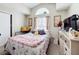 This bedroom features a large window and vaulted ceilings and neutral decor at 3233 Brewster Dr, Kissimmee, FL 34743