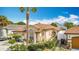 Inviting single-Gathering home with a tidy front yard, a driveway, and a well-maintained landscape at 3233 Brewster Dr, Kissimmee, FL 34743