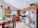 This functional kitchen features wooden cabinets, stainless steel appliances, and tile flooring at 3233 Brewster Dr, Kissimmee, FL 34743