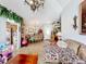 Spacious living room with tile flooring flowing to dining area, offering comfortable and inviting living space at 3233 Brewster Dr, Kissimmee, FL 34743