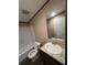 Well-lit bathroom features a granite countertop, oval sink, and a shower-tub combo at 34517 Laralack Ave, Leesburg, FL 34788