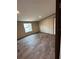Bright bedroom with vinyl floor and a window at 34517 Laralack Ave, Leesburg, FL 34788