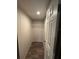 Walk-in closet with wood-look floor and wire shelving at 34517 Laralack Ave, Leesburg, FL 34788