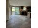 Open-concept kitchen and dining area with modern appliances and lots of natural light at 34517 Laralack Ave, Leesburg, FL 34788