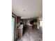 Bright kitchen boasting modern appliances, an island, and beautiful wood-look laminate flooring at 34517 Laralack Ave, Leesburg, FL 34788