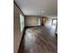 Spacious living room boasting wood-look floors, recessed lighting, and a contemporary feel at 34517 Laralack Ave, Leesburg, FL 34788