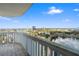 Balcony view overlooking a lake and the city skyline on a sunny day, showcasing the community's amenities at 400 E Colonial Dr # 1504, Orlando, FL 32803