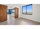 Bright bedroom featuring sliding barn doors and a large window with a scenic city view at 400 E Colonial Dr # 1504, Orlando, FL 32803