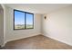 Bright bedroom showcasing a herringbone floor, with a large window offering scenic city views and providing ample natural light at 400 E Colonial Dr # 1504, Orlando, FL 32803