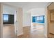 Spacious open-plan living room with herringbone floors and large windows showcasing scenic city views at 400 E Colonial Dr # 1504, Orlando, FL 32803