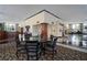 Spacious lobby with a round table and chairs set on patterned carpet, complemented by elegant decor and ambient lighting at 400 E Colonial Dr # 1504, Orlando, FL 32803