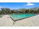 Large outdoor community pool with ample lounge chairs, shaded seating, and picturesque views of the surroundings at 400 E Colonial Dr # 1504, Orlando, FL 32803