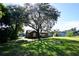 Lush backyard with mature trees providing shade and character to the property at 4235 W Vista Ct, Kissimmee, FL 34746